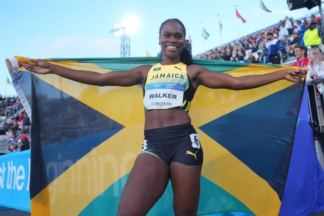 Jamaica’s Sanique Walker celebrates after winning the Women’s 400m Hurdles Final at the Commonwealth Games in Glasgow, Scotland yesterday.